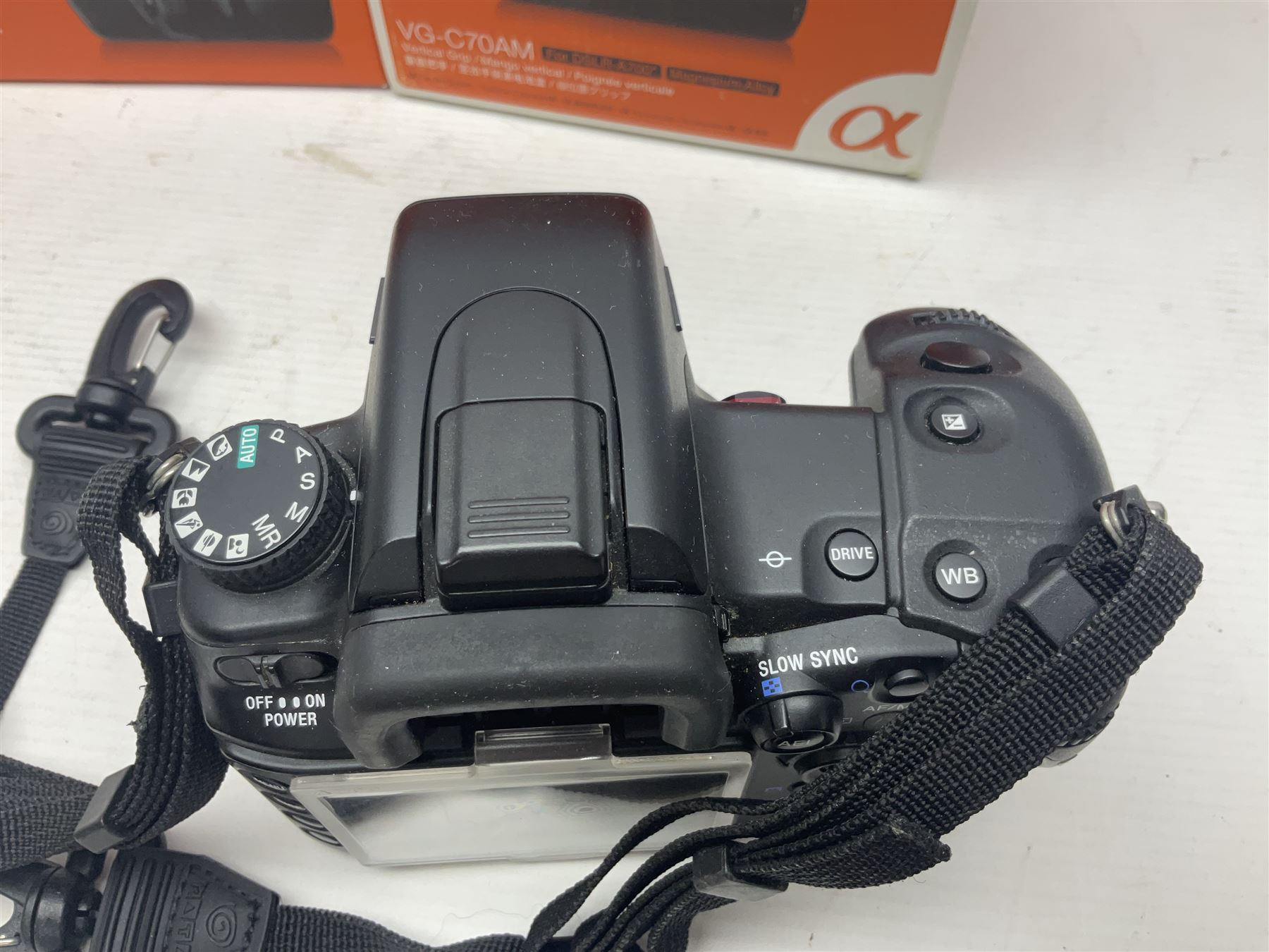 Sony Alpha A700 camera body, serial no 2340937, Sony Alpha A77 camera body, serial no 0715406, together with Sony angle finder and two firm holding grips, all with original boxes  