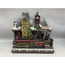 Christmas decorations; Premier LED Christmas Village scene with moving train, together with three Lumineo christmas scenes, and other similar 