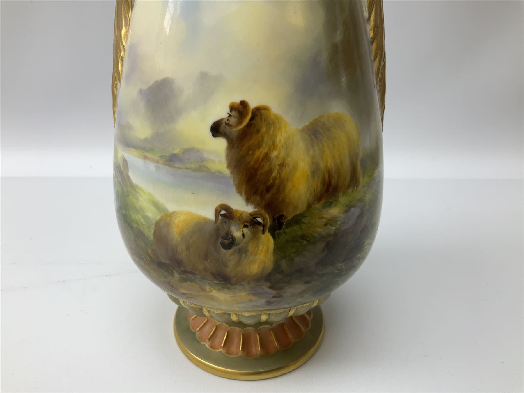 Early 20th century Royal Worcester vase decorated by Harry Davis, of ovoid form with twin acanthus mounted handles and waisted high neck supporting a domed cover, upon a circular foot, the body hand painted with sheep in a highland landscape, signed H Davis, with puce printed marks beneath including shape number 2425, and date code for 1907, H27.5cm