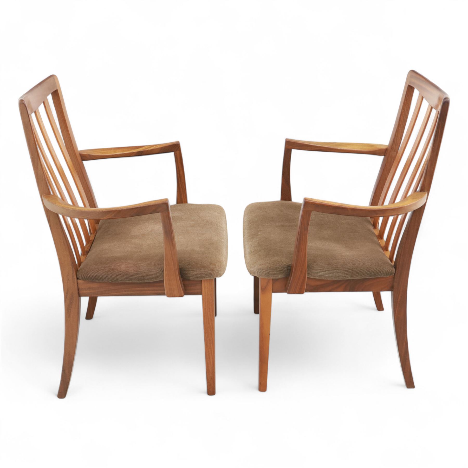 G Plan - mid-20th century teak extending dining table, oval top with integrated extension leaf, raised on tapering legs, together with a set of six slat back dining chairs including two carvers, upholstered in dark green velour (Extends to 210cm)