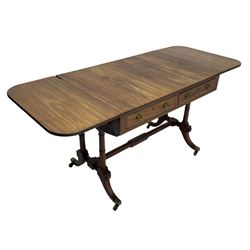 George III mahogany sofa table, rectangular drop-leaf top with reed moulded edge and rounded corners, fitted with two frieze drawers and two opposing false drawers, quadruple collar turned pillar supports on turned and block platforms, splayed and moulded supports with brass cups and castors 