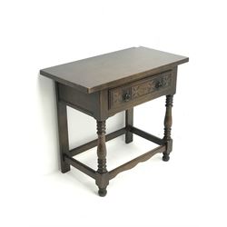 20th century oak side table fitted with carved single drawer, real stile supports and front turned supports 