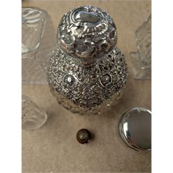 Collection of perfume bottles, including cut glass, silver mounted, coloured glass and miniature examples, tallest H