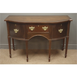  Edwardian mahogany serpentine front sideboard, single drawer flanked by two cupboards, square tapering supports on spade feet (W122cm, H80cm, D56cm), and a rectangular mahogany dressing mirror, on arched supports  
