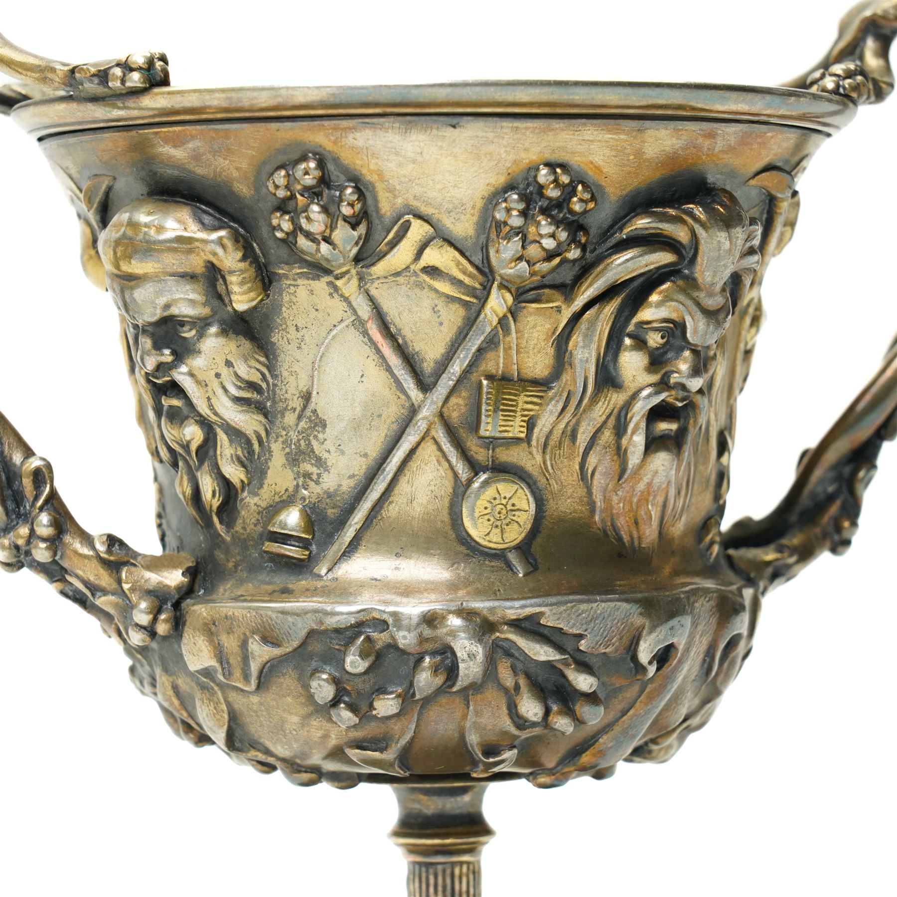 Christofle 'Tresor d'Hildesheim' facsimile gilt metal two handled cup decorated with masks, leaves etc H13cm and a bowl from the same collection with two handles and a raised pattern of leaves on a pedestal foot D19cm (2) 