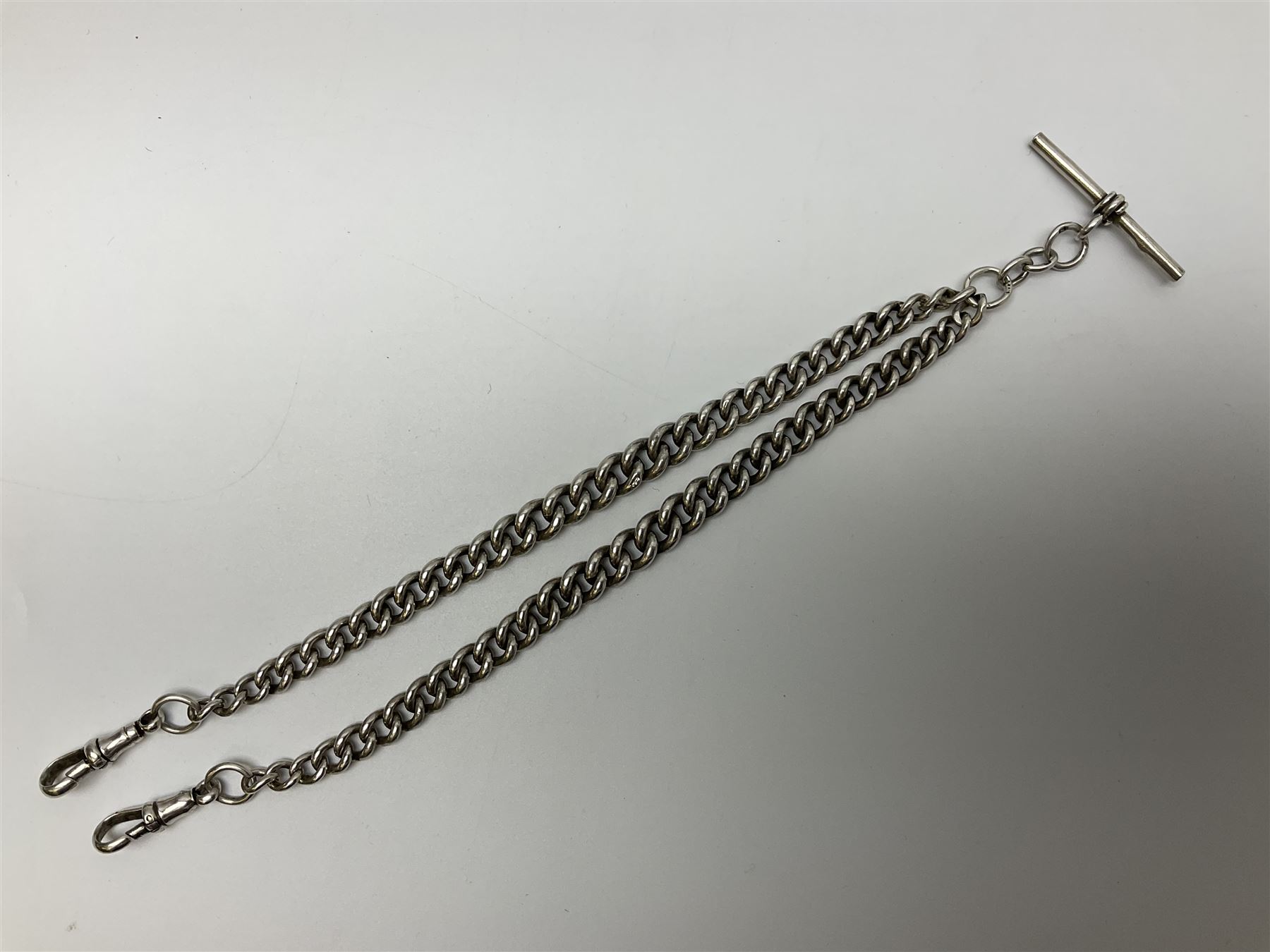 Early 20th century silver tapering Albert chain, hallmarked to T bar and clips, with lion passant stamped on each link