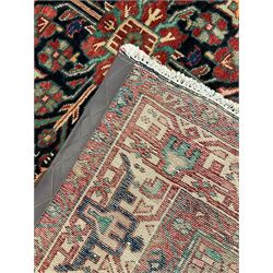 Persian Malayer rug, the field decorated with tree of life, floral, animal and bird motifs, surrounded by three band border with geometric design