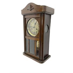 German -1930s oak wall clock, striking the hours and half hours on a gong.