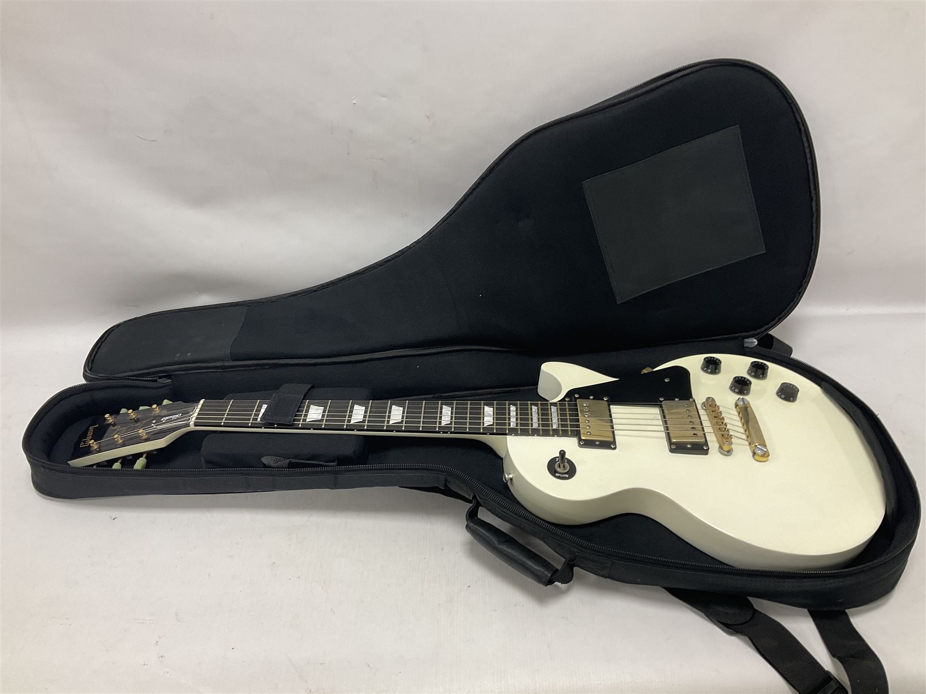 2010 Gibson Les Paul studio guitar, serial no101500537 in white finish with gold and pale green hardware, in Auden soft carry case, guitar L100cm