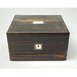 A Victorian coromandel box, with inset mother of pearl panel to the hinger opening cover, mother of pearl escutcheon, and secret drawer beneath, (lacking interior), H17cm L30cm D22.5cm.   