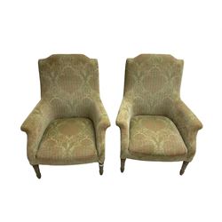 Pair Edwardian design armchairs, upholstered in foliate patterned fabric, on turned supports