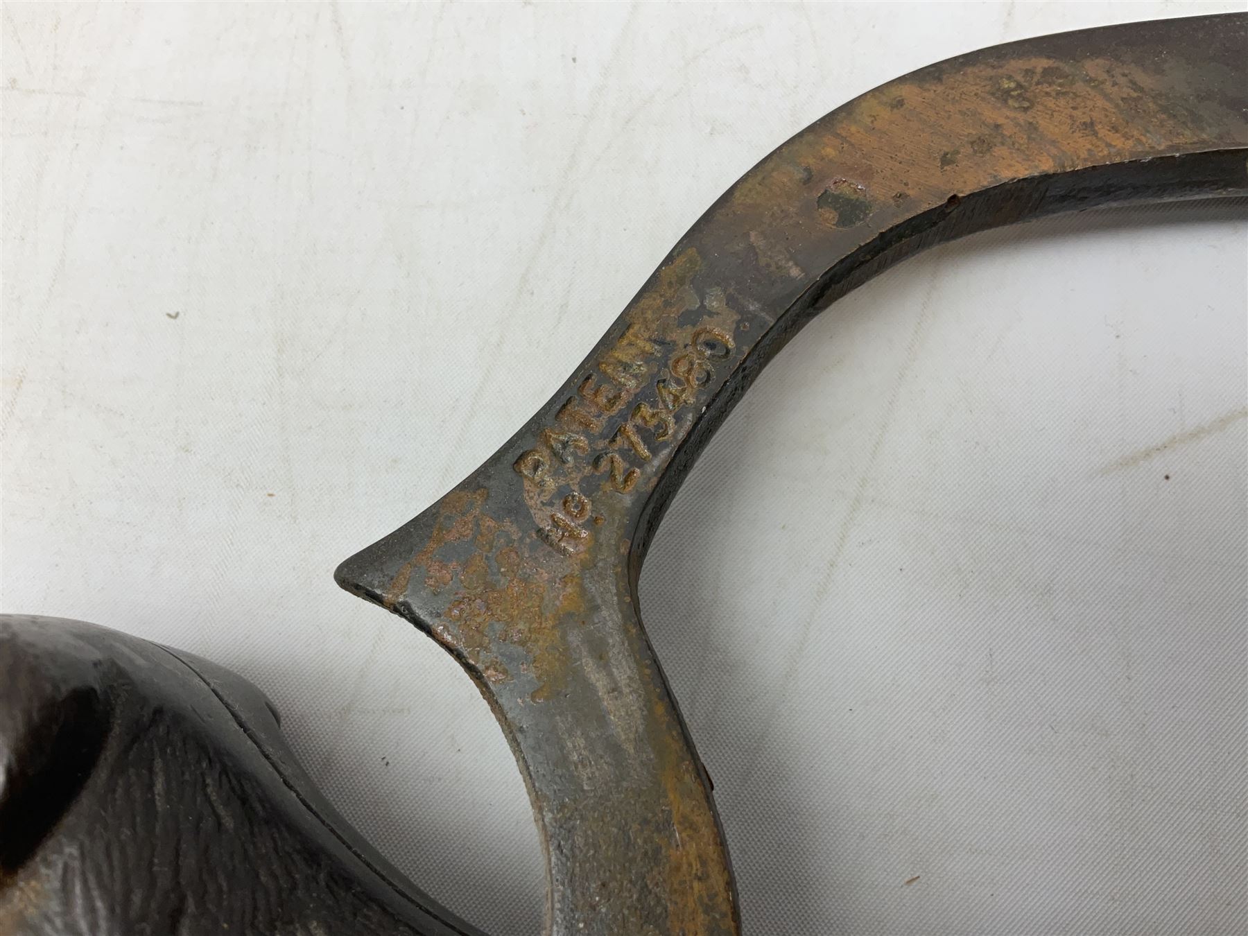 Cast metal nutcracker, in the form of a dog together with a pair of Swift Saratoga 8x40 binoculars in leather case and a hip flask, the glass flask covered in leather to the top with a detachable silver plated cup to base