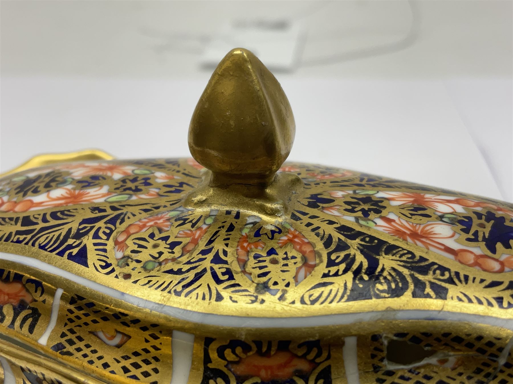 Royal Crown Derby Haiku pattern miniature clock, together with 1128 Imari pattern trinket box with cover and teddy bear figure, all with printed marks beneath   