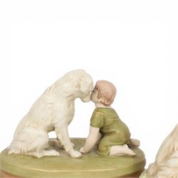 Two Royal Dux figures, each modelled as a toddler and dog, upon oval base, one titled 'Can't you talk?', model no 2369, each with applied and impressed marks beneath, largest example H19cm