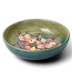 William Moorcroft African Lily pattern bowl, on a green ground, blue signature mark to base, D22cm