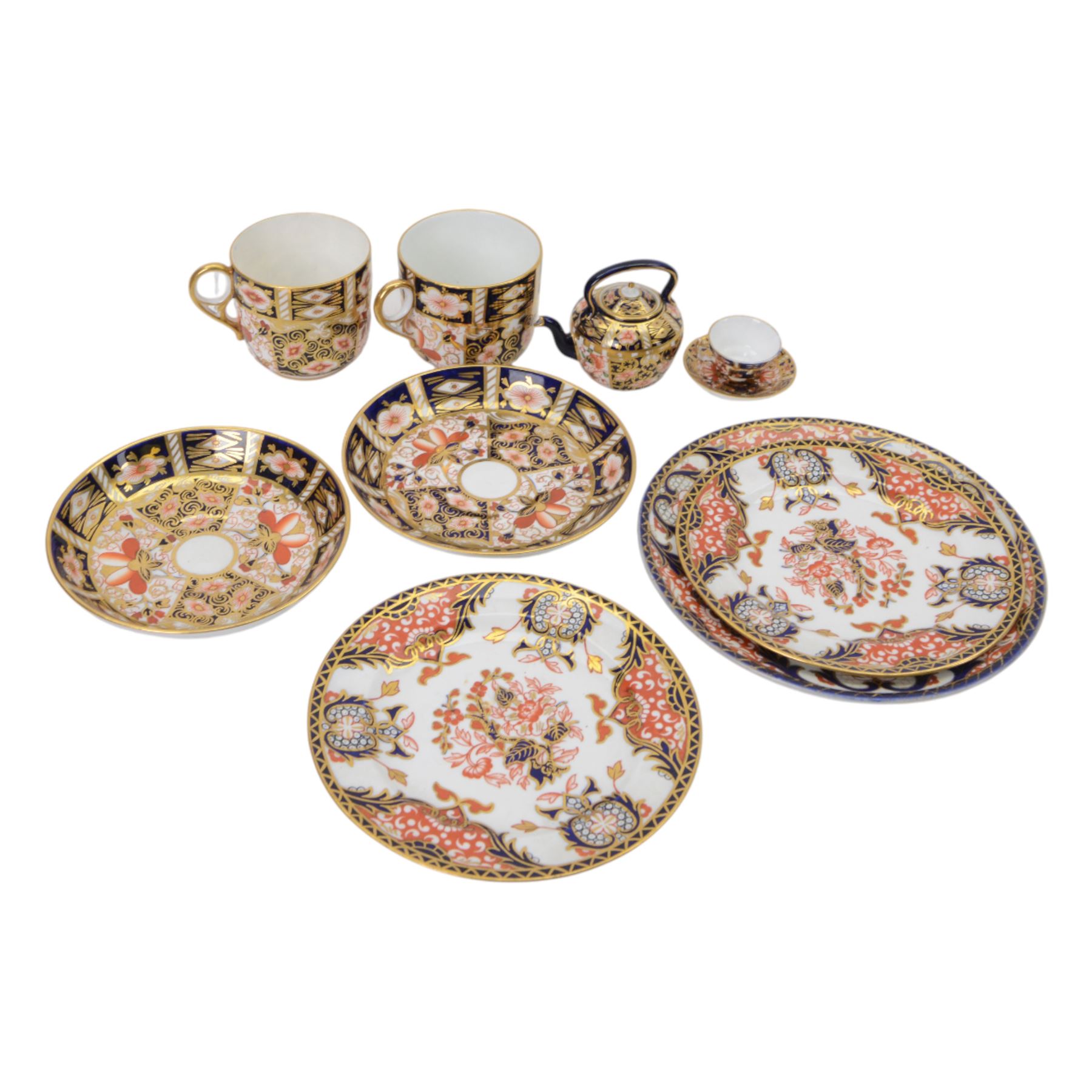 Royal Crown Derby imari pattern, miniature teapot and teacup, together with two cups and saucers and three plates