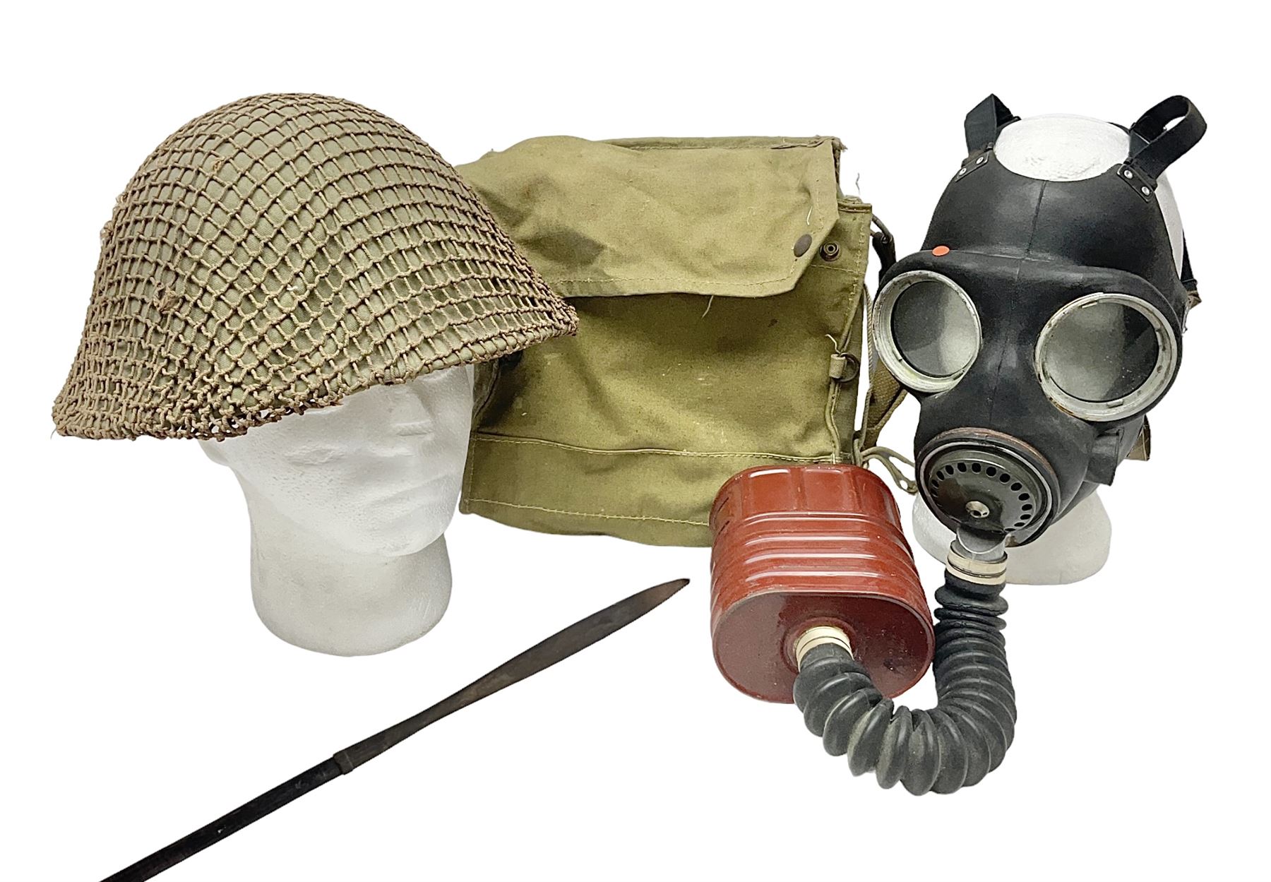 1970s British turtle style steel helmet with liner, green cover and netting; liner marked C.W.L. 1972 No.8415-99-973-6750; size 6 3/4 - 6 7/8; WWII respirator dated 1941 in canvas carrying case; and a Native long-shafted spear with iron head and bound plain round haft L165cm (3)