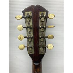 Late 19th century Italian lute back mandolin with segmented bowl back, bears label Gennaro Maglioni Napoli L61cm; in ebonised wooden case; together with another similar damaged Italian lute back mandolin for restoration or spares (2)