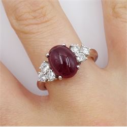 18ct white gold cabochon ruby ring, set with three round brilliant cut diamonds either side, hallmarked, ruby approx 3.20 carat, total diamond weight approx 0.55 carat