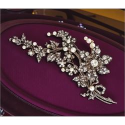 19th century gold and silver diamond and pearl en tremblant detachable brooch, the flower tremblant with a principal old cut diamond of approx 1.90 carat, the petals and stamen set with old cut and rose cut diamonds, total diamond weight approx 9.10 carat, to a foliate spray set set with further rose cut diamond and white / pink / cream pearls and ribbon tie