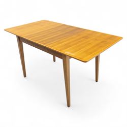 Gordon Russell - mid 20th century teak dining suite, comprising rectangular extending dining table and six matching chairs including one carver, each chair with padded upholstered seat and backrest in vinyl, on square supports, the table with plain top and rounded edges on tapered legs, an example of the firm’s functional post-war design with restrained modernist detailing (Chairs H 85cm, W 47cm, D 46cm) (Extends to 154cm)