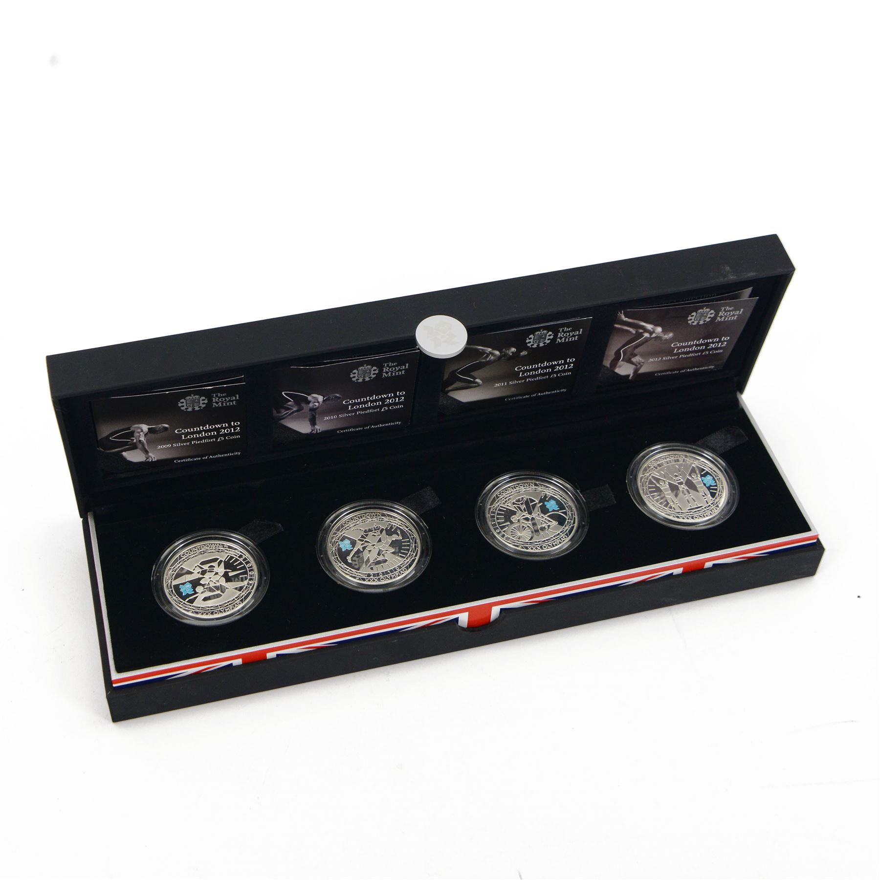 The Royal Mint United Kingdom 'Countdown to London 2012' four silver proof piedfort five pound coin set, dated 2009, 2010, 2011 and 2012, cased with certificate