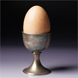 Anthony Gordon Elson -  Elizabeth II limited edition novelty silver and silver gilt surprise egg, the cup holding a gilt lined egg, bayonet opening to reveal two bunnies 4/200  H11cm London 1981