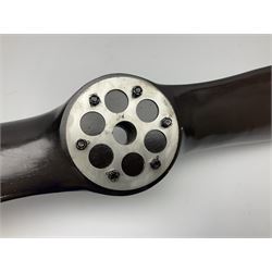 British World War II era laminated wooden four-bladed generator propeller, late 1930s-40s, used to power a drogue winch used by a target tug aircraft; marked with DRG drawing number T29505-2-4 N760 on the hub and impressed circle mark 'P.M.P.W. 1'; light weight four plank mahogany laminate with 9.5cm diameter metal plates mounted to front and rear faces of hub for 15mm shaft; one plate marked T29504-2/198 D91cm; together with a modern reproduction brass edged mahogany two-blade propellor L