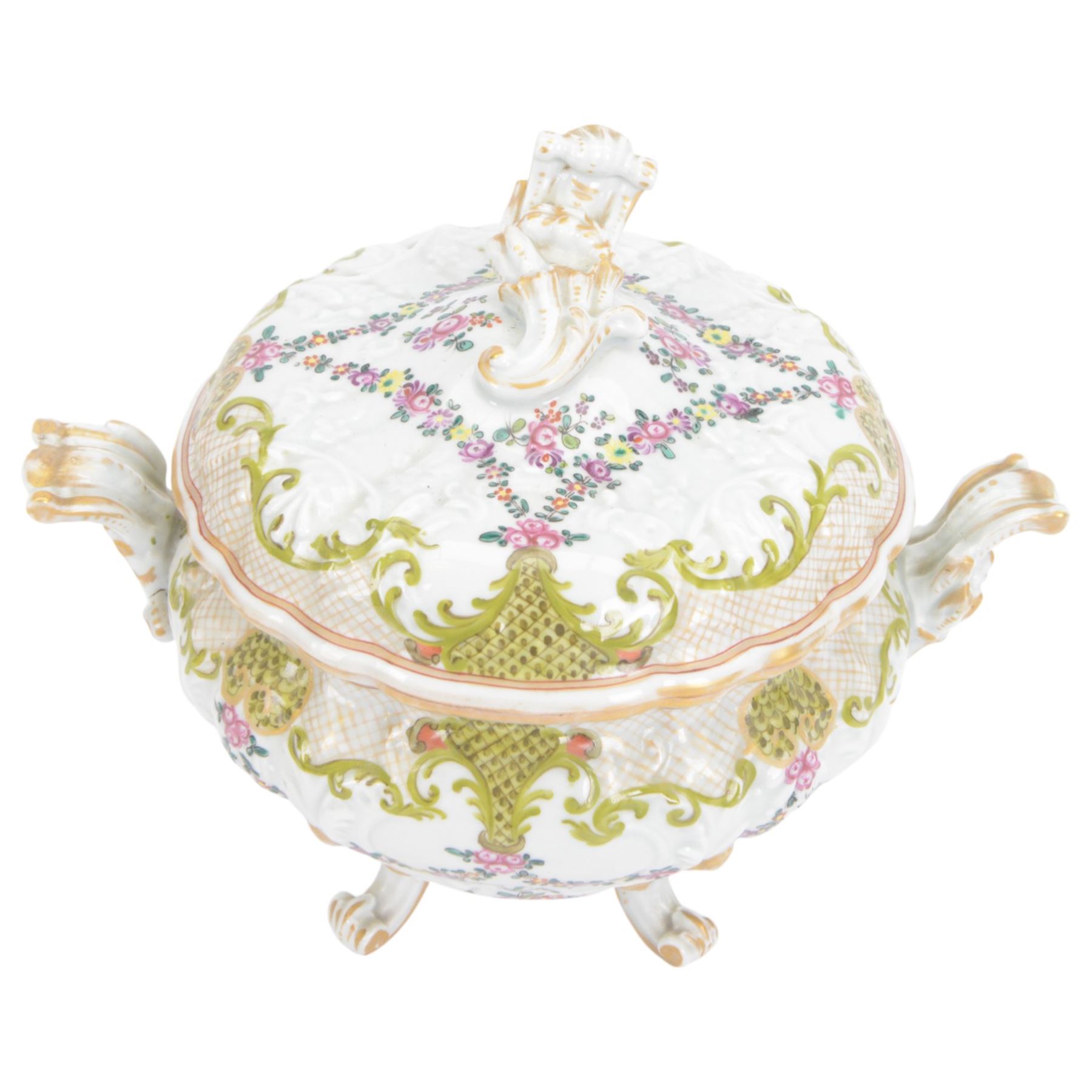 19th Century French faience tureen and cover, decorated with floral swag and net detail with gilt scrollwork handles, raised on four scroll feet, H20cm