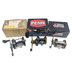 Three multiplier spool sea fishing reels, to include Swedish Abu Ambassaduer 700c Black, with spare spool, Swedish Abu Garcia Ambassadeur 6500 C3 CT MAG and Penn 515 MAG2, all boxed