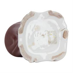 Mid 19th century French porcelain inkwell, possibly Jacob Petit, circa 1884, modelled as a anthropomorphic bear seated within an armchair, wearing cap, gown and slippers, reading a letter to a small cub holding a bunch of flowers, upon a shaped and scrolling base, impressed and incised marks beneath, H19cm
