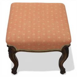 19th century mahogany framed footstool on floral carved cabriole supports upholstered in coral fabric