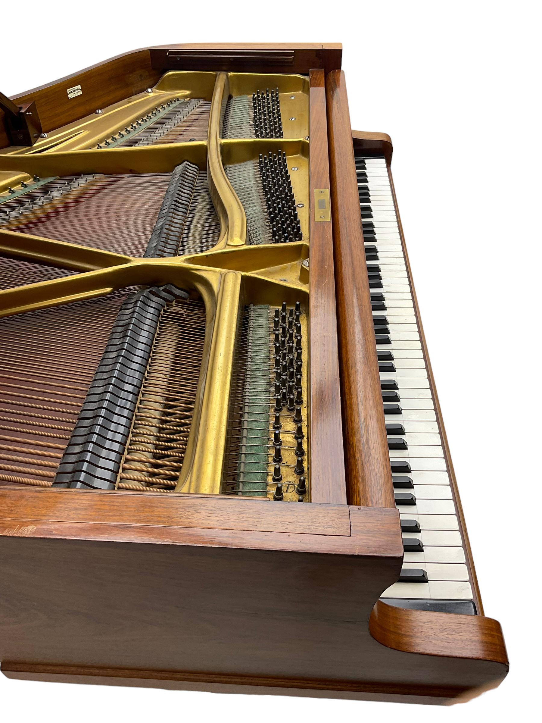  Antonin Petrof - Walnut overstrung baby grand piano, 7 0catve 85 key compass with original strings, tuning pins, damper felts and hammer heads, with roller keyboard action and iron frame, sustaining and una-corda pedals, sliding open lattice music desk, supported on square tapering legs with brass cups and castors, with inner ebonised key fall and ivorine label inscribed 'Supplied by Harrods, London'.
