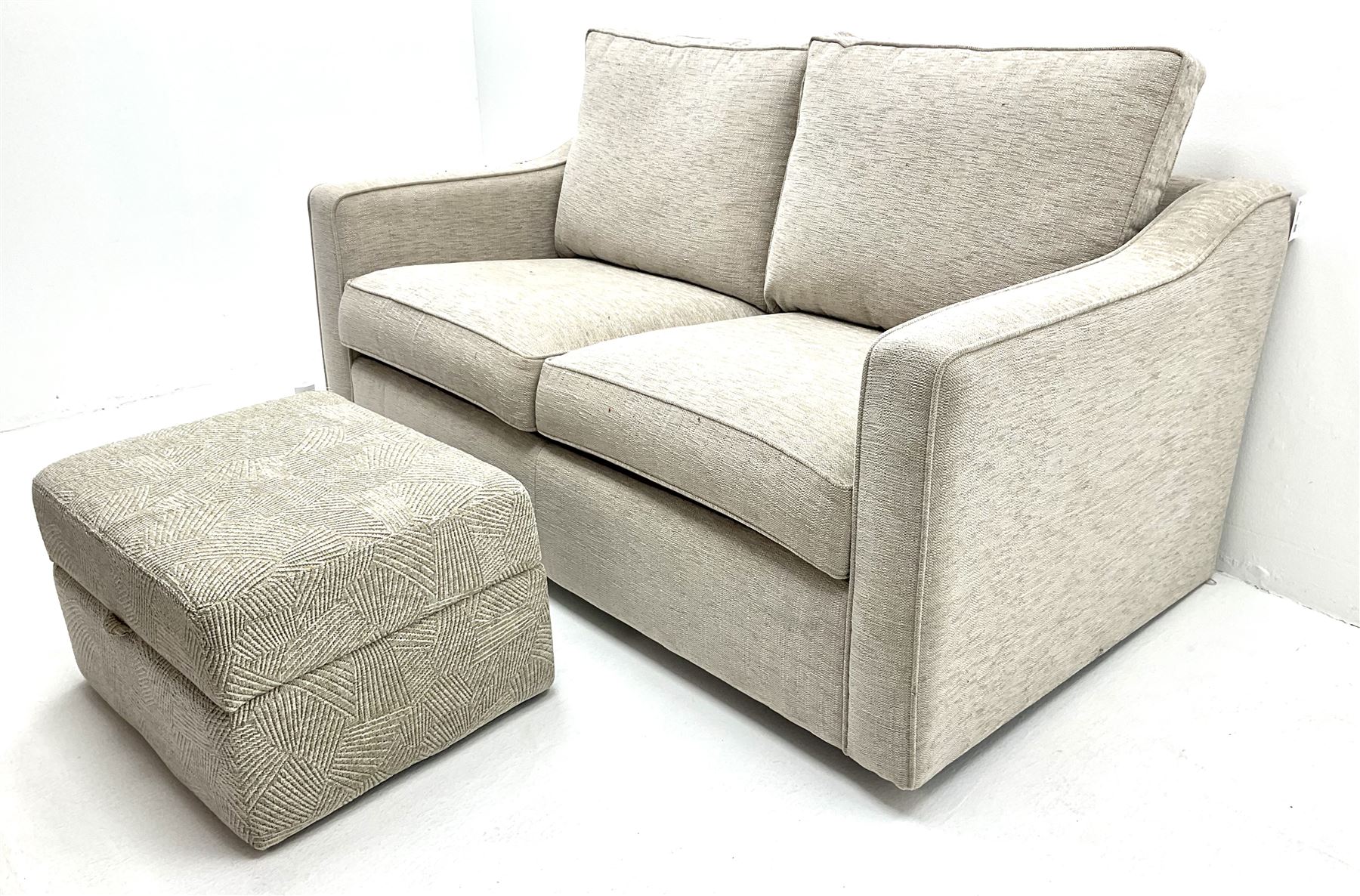 Two seat metal action sofa bed upholstered in a neutral fabric (W157cm) with storage stool (2)