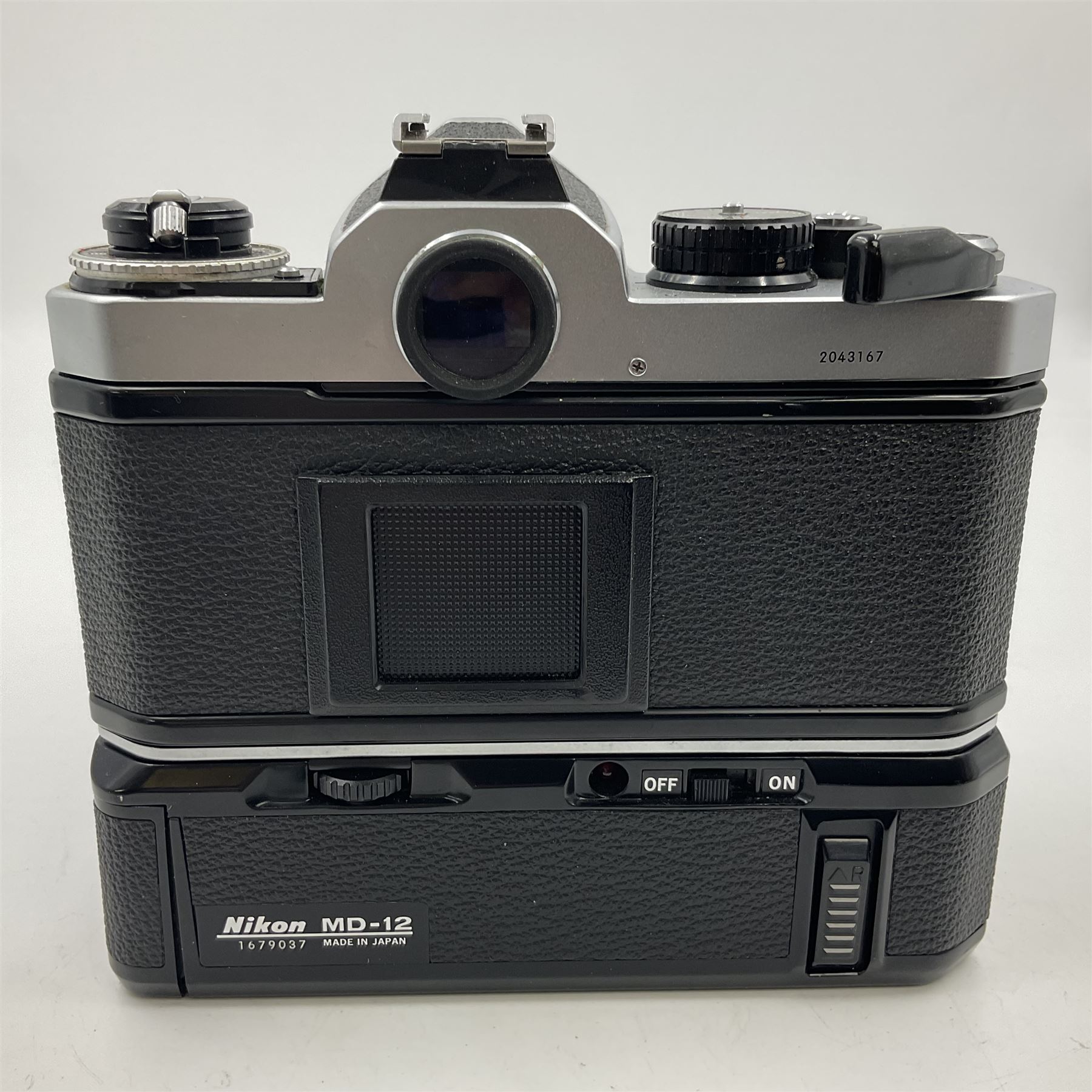 Nikon FE2 camera body, serial no. 2043167, with 'Nikon Zoom-NIKKOR 35-70mm 1:3.3-4.5' lens, serial no 3006624 and Nikon MD-12 Motor Drive, serial no. 1679037