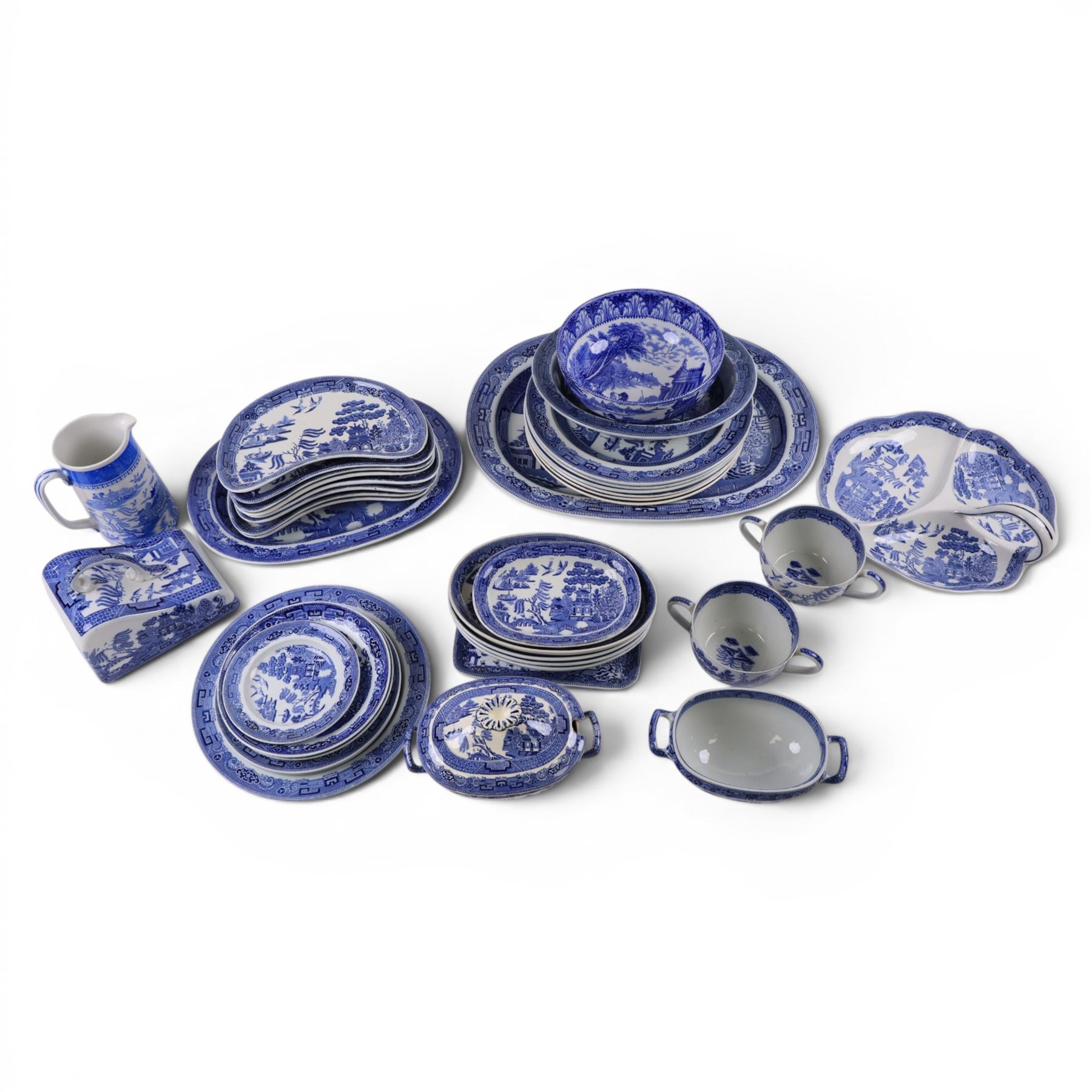Collection of blue and white dinner wares, mainly Wedgwood Willow pattern, including serving platter, dinner plates etc   