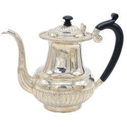 Late 20th century Indian Colonial silver six piece tea and coffee service, comprising coffee pot, hot water pot, teapot, milk jug, open sucrier and tray, all of oval part fluted form, the tea and coffee pot with ebonised wooden handles and finials, stamped SIL and with maker's mark for Cooke & Kelvey New Dehli, within two boxes and with original receipt for 1999