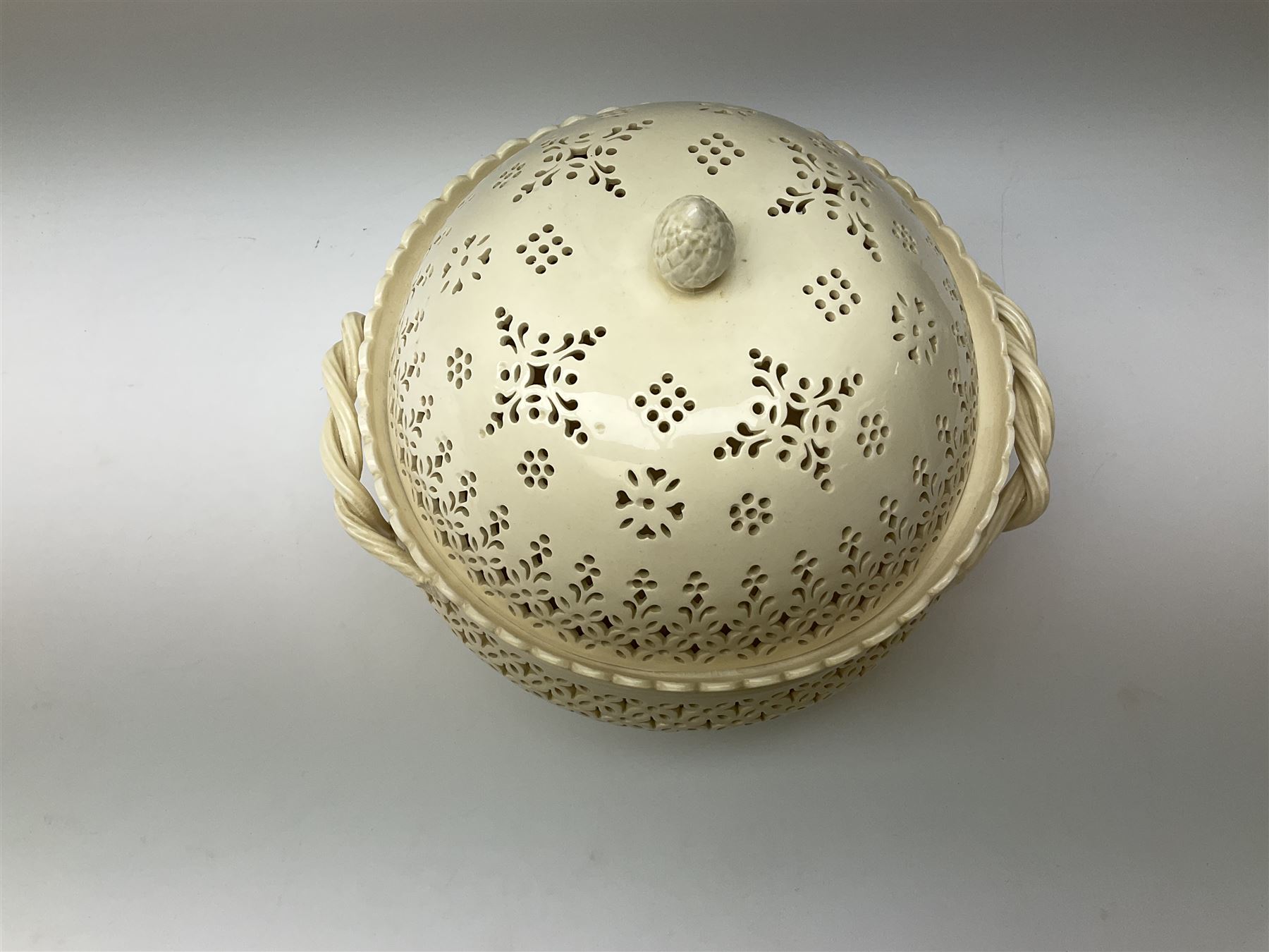 Large 20th century Leeds pottery basket and cover, of bulbous form with pierced detail and twin rope handle, with impressed mark beneath, H23cm D25cm