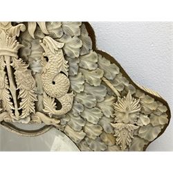 Pair 19th century French Dieppe bone and ivory wall mirrors, the oval bevelled mirror plates within rectangular frames with shaped tops, profusely decorated with ivory leaves, further detailed with carved bone armorial type crest inscribed 'SGOTORVM', putti, fish and mask heads, H81cm W48cm