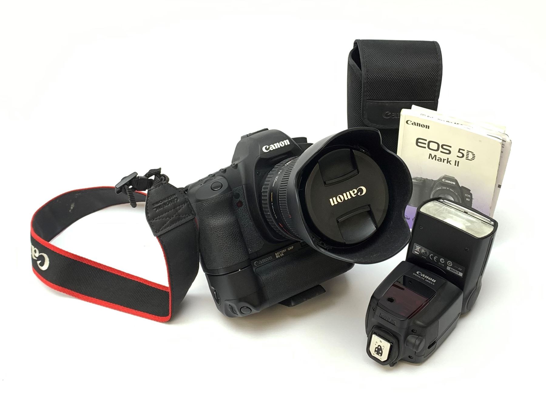 Canon EOS 5D camera body with Canon 'BG-E6' battery grip, Canon 'Speedlite 580EXII' flash and Canon lens 'Canon Zoom Lens EF 24-105mm 1:4 L IS USM' with Canon EOS 5D Mark II instruction manual