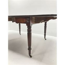 19th century figured mahogany drop leaf telescopic Pembroke dining table with leaf, rounded rectangular top with lobe moulding, plain frieze with turned roundels at each leg, turned and reeded Gillows type supports with brass cups and castors, 194cm x 108cm, H72cm