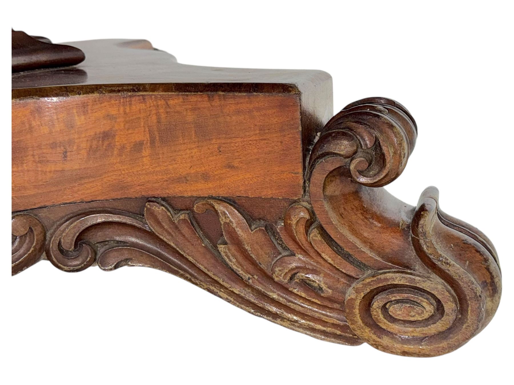 Victorian mahogany tilt-top table dining table, rounded tilt rectangular top with moulded edge, on octagonal column, raised on shaped quadriform base with bold scrolled feet