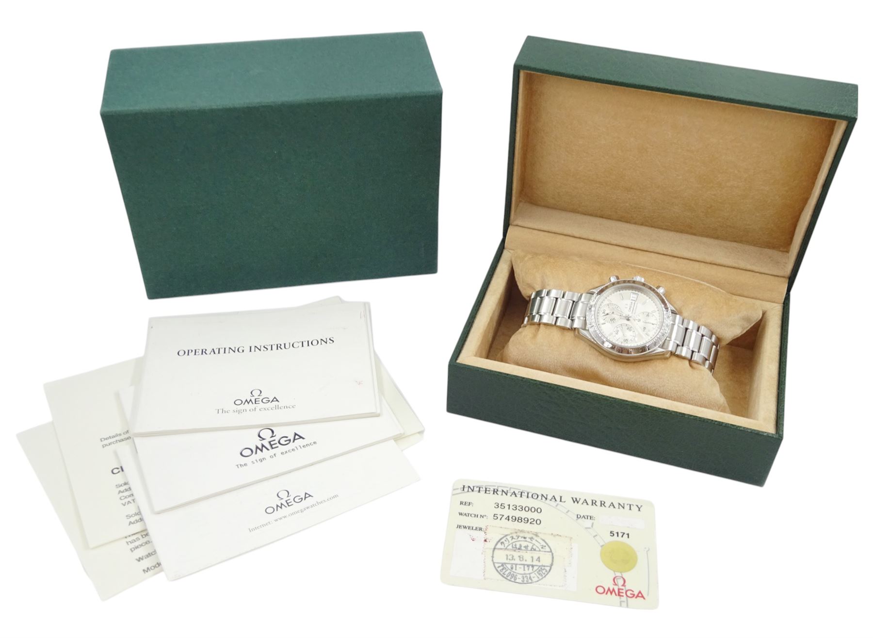 Omega Speedmaster gentleman's stainless steel automatic chronograph wristwatch, back case No. 175.0083, serial No. 57498920, silvered dial with date aperture and subsidiary dials for constant seconds, 30 minute and 12 hour register, stainless steel tachymetre scale bezel, on Omega stainless steel bracelet, with fold-over clasp, with warranty card