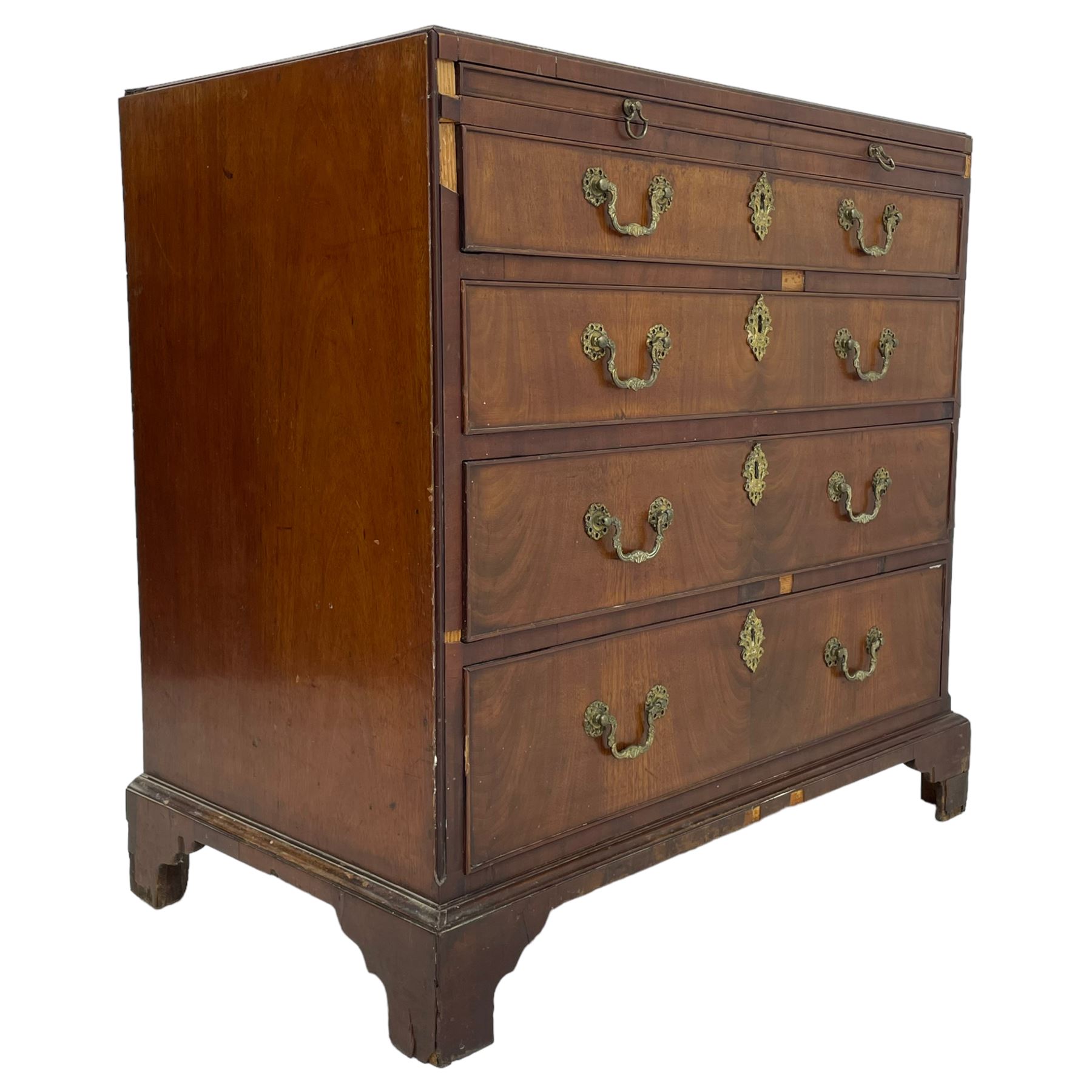 George III mahogany chest, banded caddy top with moulded edge, brushing slide over four graduating cock-beaded drawers, ornate cast gilt metal handle plates and escutcheons, swan neck handles cast with dolphins, shells and C-scrolls, lower moulding over bracket feet