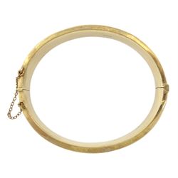 9ct gold hinged bangle with bright cut decoration by Henry Griffith & Sons Ltd, Birmingham