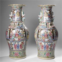 Large pair of 19th century Cantonese famille rose vases, each painted with various courtly...