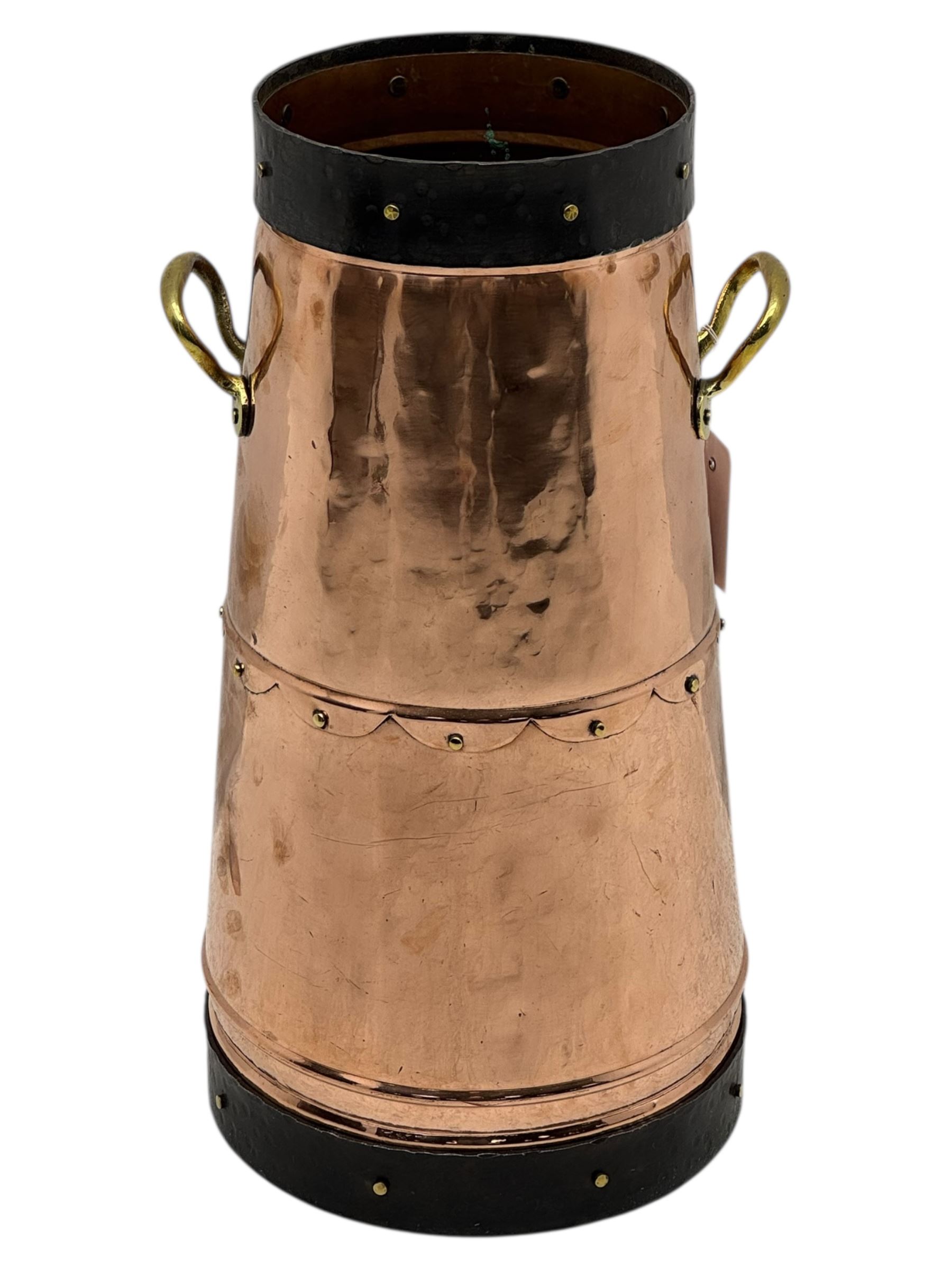 20th century copper milk churn, of tapering cylindrical form with applied brass twin handles and darkened banded rim and base