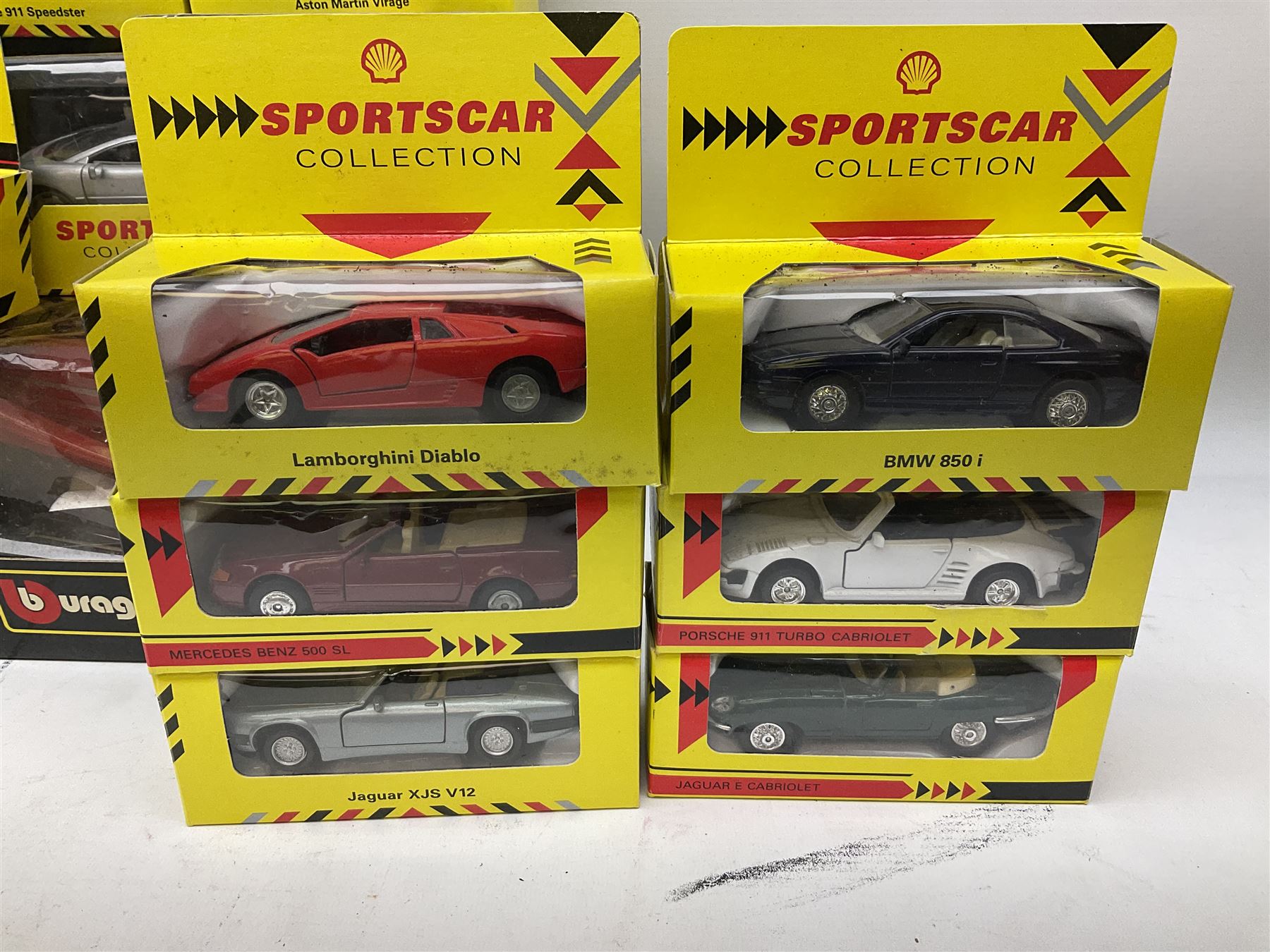 Seventeen Shell Sportscar Collection die-cast models including 1:24 scale Jaguar XJ220 by Maisto; and Bburago 1:20 scale die-cast model Mercedes Benz 500K Roadster (1936); all boxed (18)