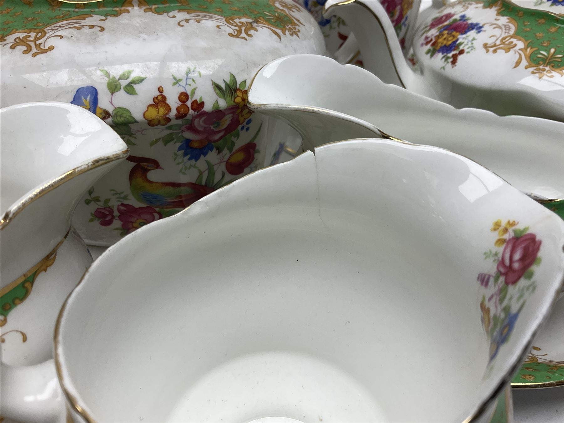 Paragon Rockingham pattern part tea and dinner service including three teapots, milk jug, cups and saucers of various sizes, ten soup bowls, ten side plates, ten dinner plates etc (96)