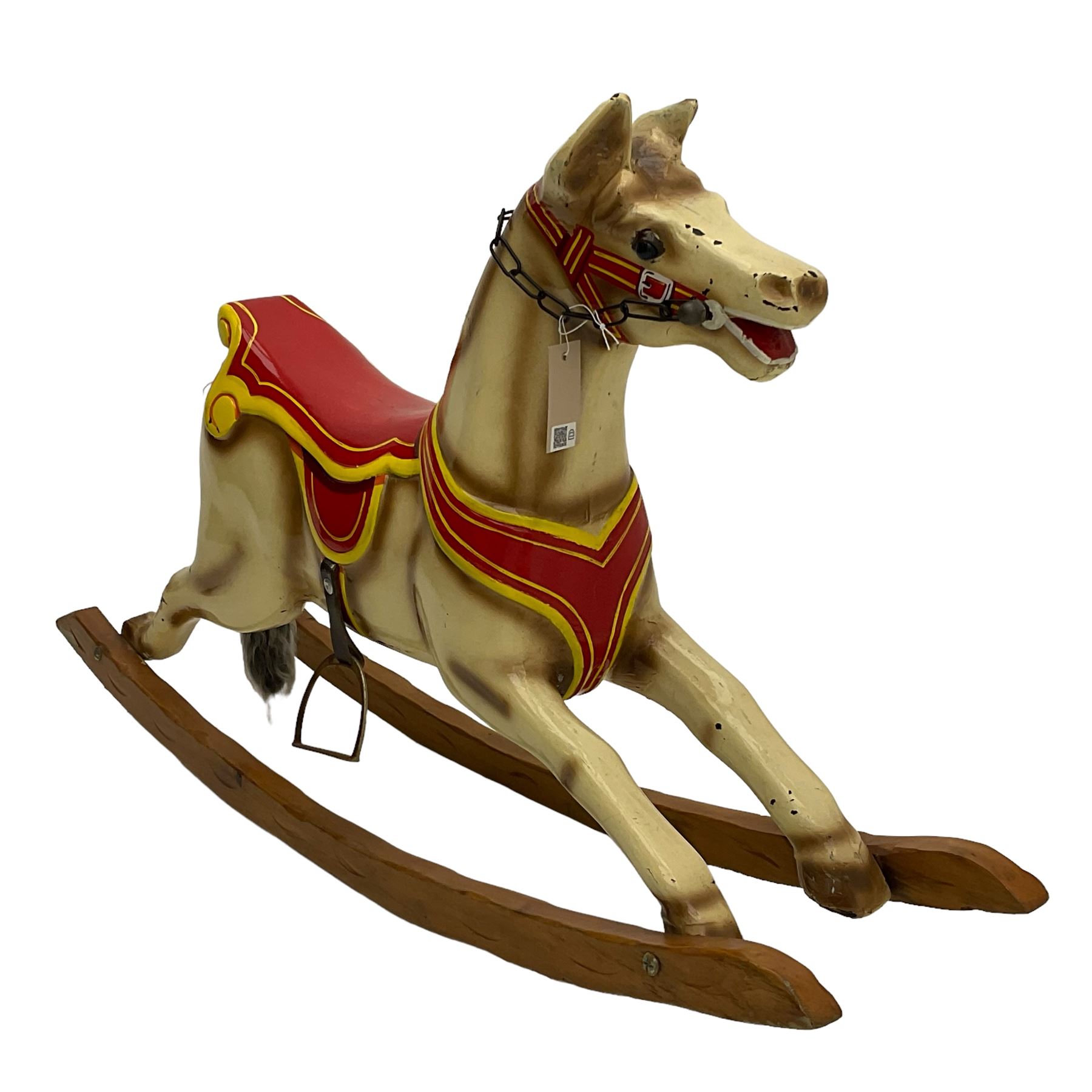 20th century rocking horse, painted body, glass eyes, metal stirrups and chain, wooden bow rocker